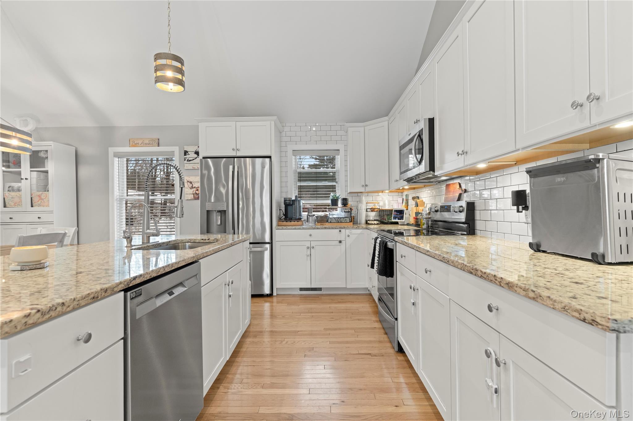 65 Beaver Road LaGrangeville, NY 12540 - Photo 8 of 40 a large white kitchen with granite countertop lots of counter top space and stainless steel appliances