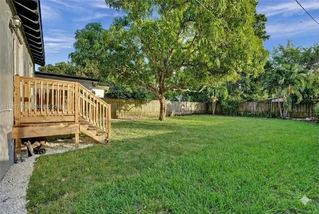 a view of a deck with a yard