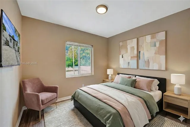 a bedroom with a bed and a couch