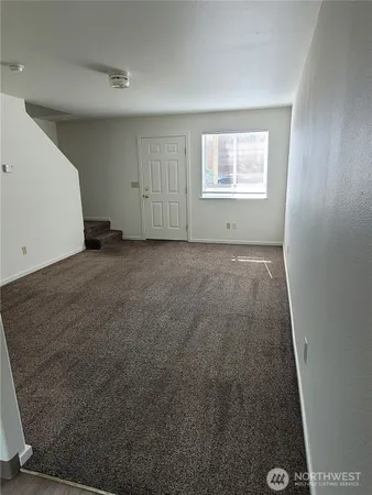 a view of kitchen and wooden floor