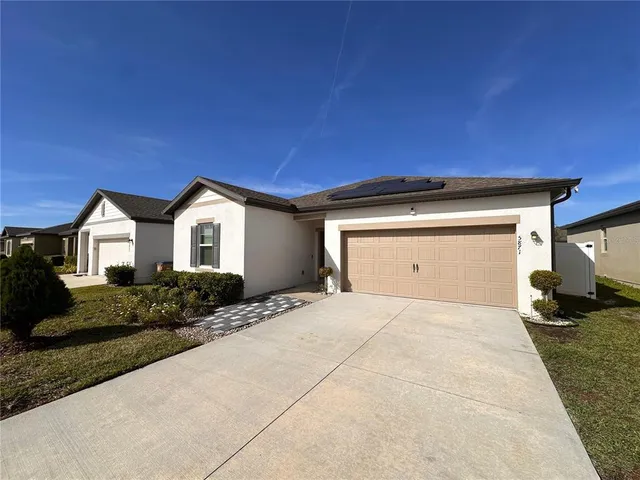 a view of garage and yard
