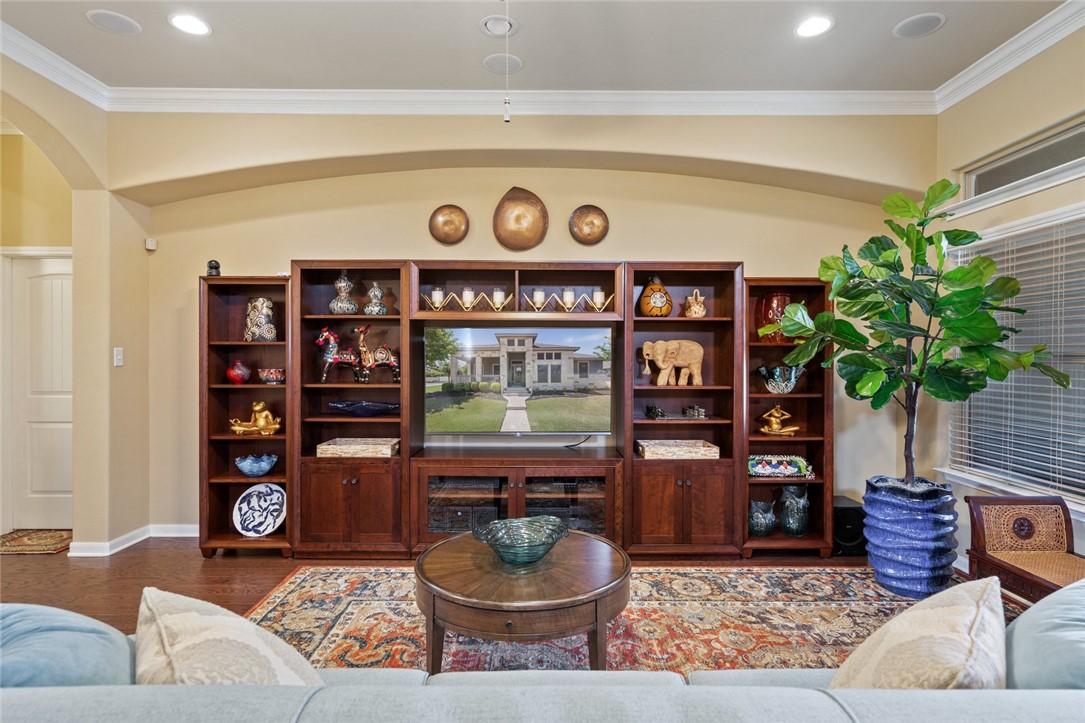 1901 Discovery Boulevard Cedar Park, TX 78613 - Photo 11 of 40 a living room with furniture and a book shelf