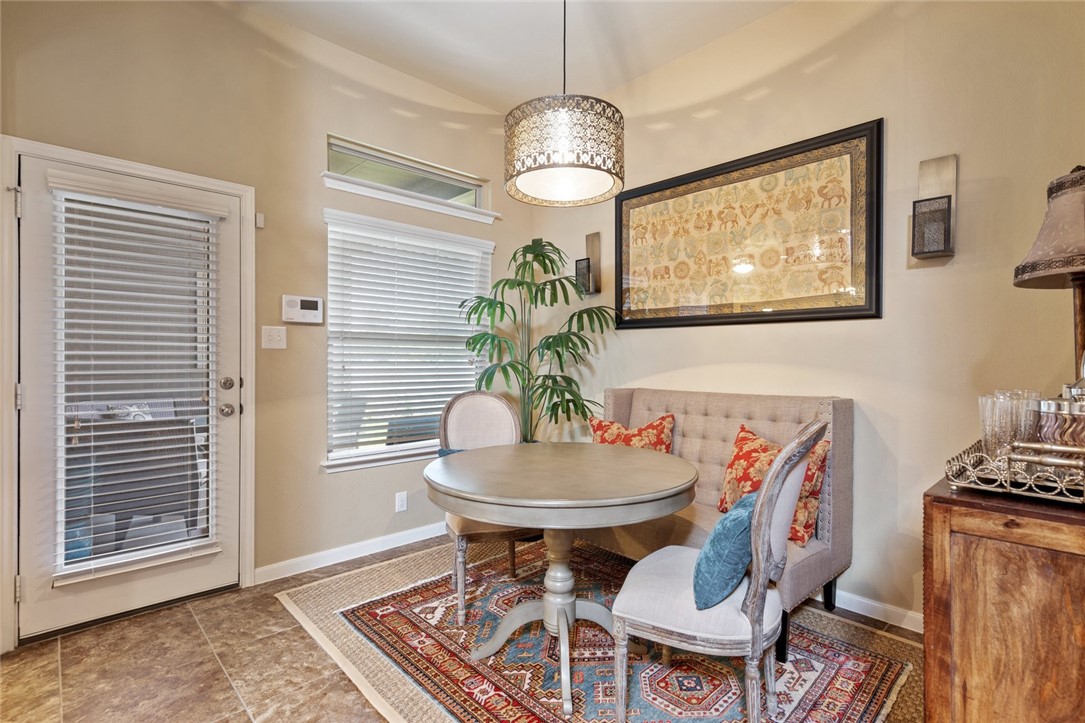 1901 Discovery Boulevard Cedar Park, TX 78613 - Photo 23 of 40 a view of a dining room with furniture and chandelier