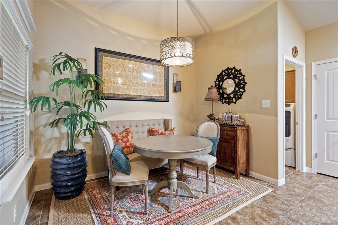 1901 Discovery Boulevard Cedar Park, TX 78613 - Photo 24 of 40 a dining room with furniture a chandelier and wooden floor