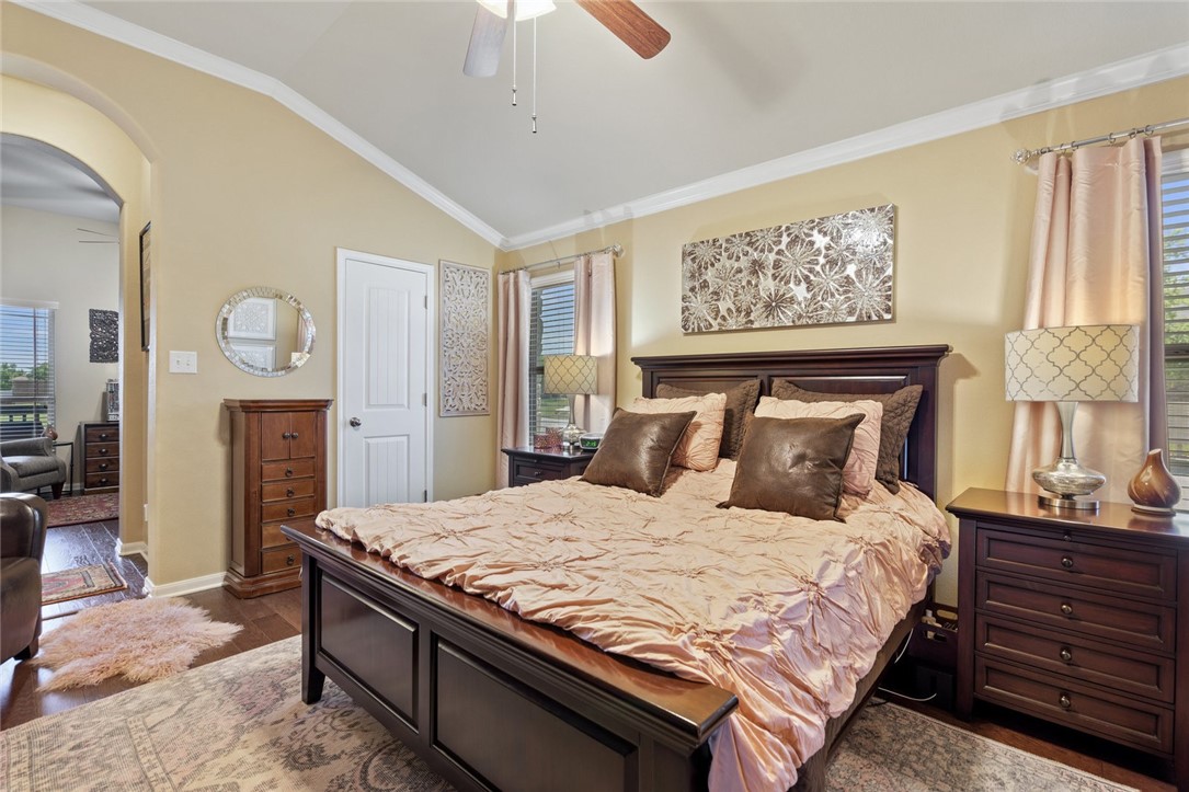 1901 Discovery Boulevard Cedar Park, TX 78613 - Photo 27 of 40 a bedroom with a bed and a chandelier