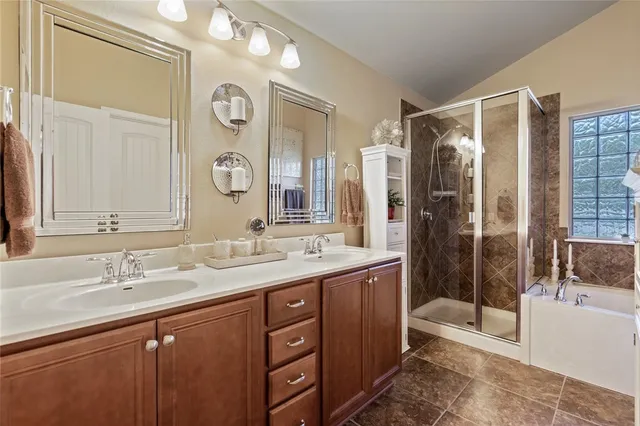 a bathroom with a bathtub and a shower