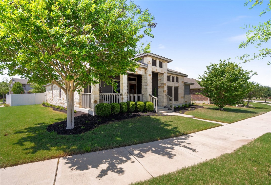 1901 Discovery Boulevard Cedar Park, TX 78613 - Photo 3 of 40 a front view of a house with garden