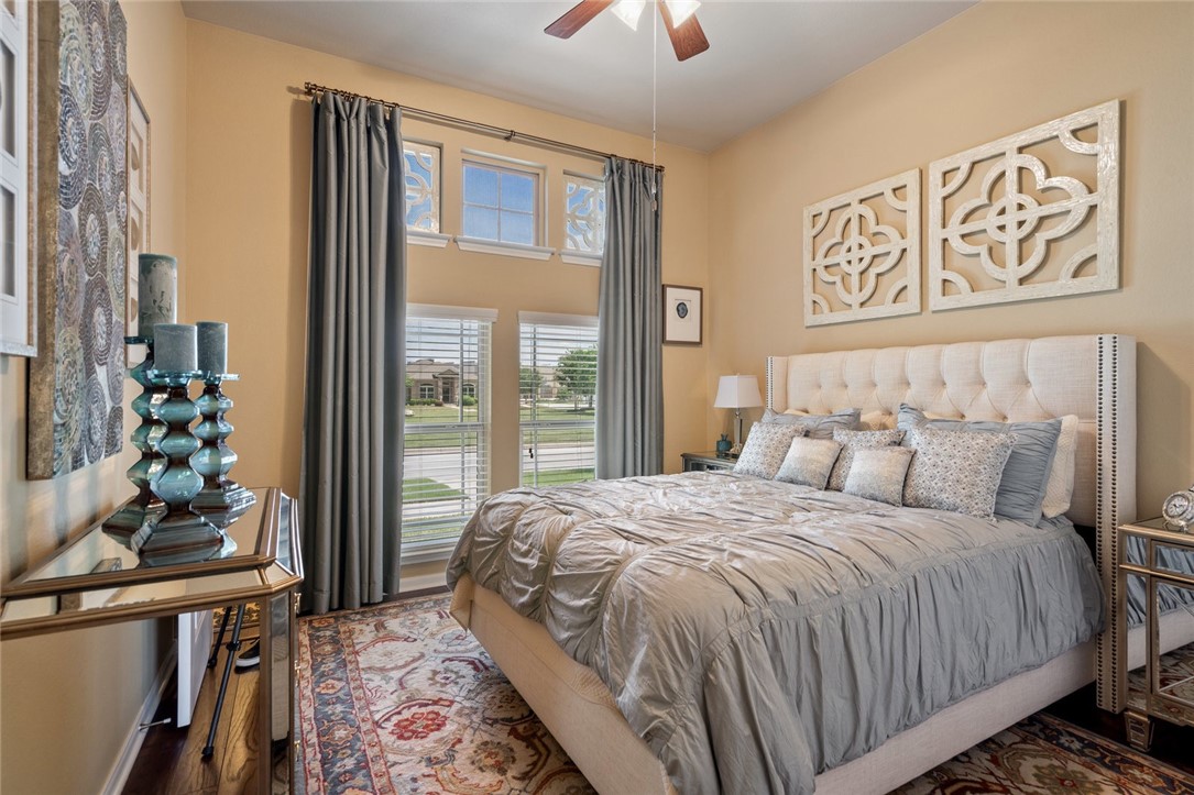 1901 Discovery Boulevard Cedar Park, TX 78613 - Photo 34 of 40 a bedroom with a large bed and a potted plant