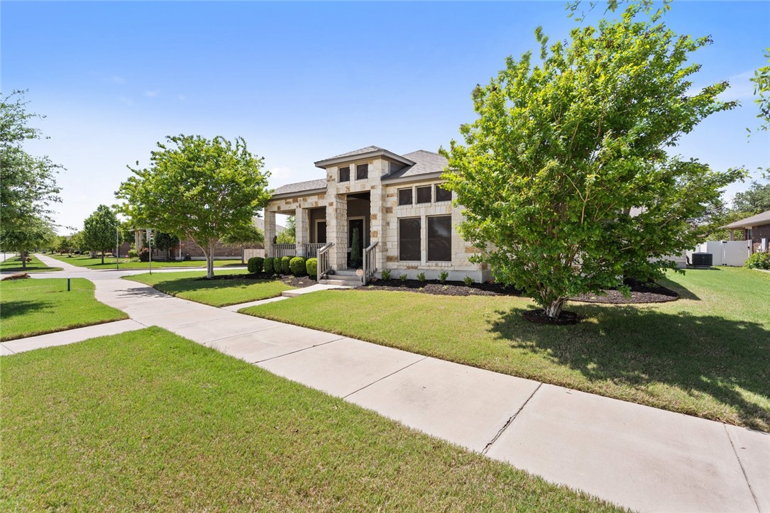 1901 Discovery Boulevard Cedar Park, TX 78613 - Photo 4 of 40 a front view of a house with a yard