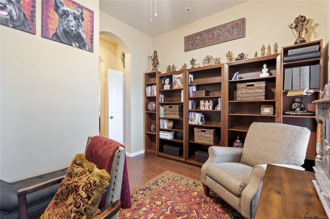 1901 Discovery Boulevard Cedar Park, TX 78613 - Photo 8 of 40 a living room with furniture and a book shelf
