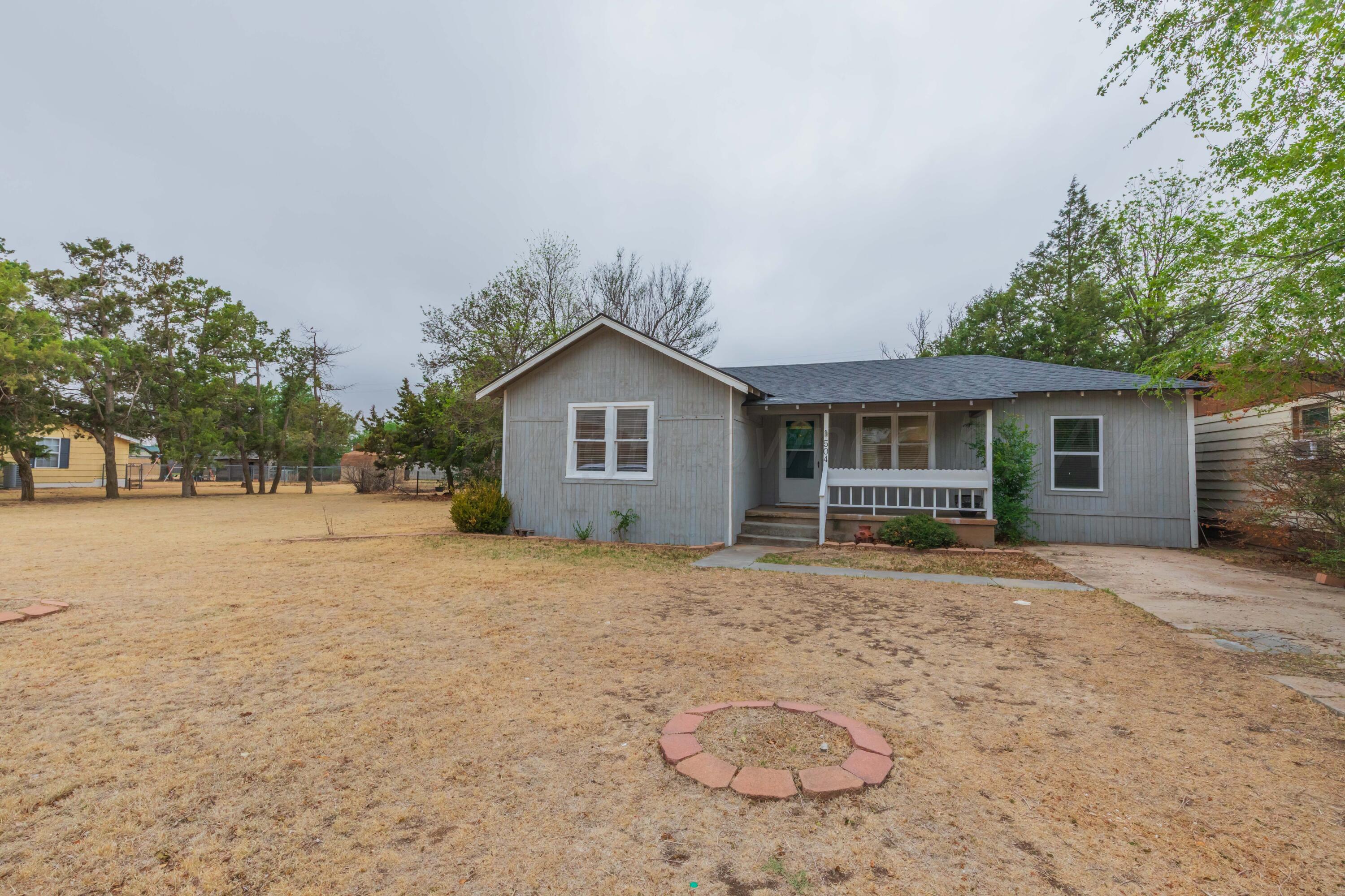 504 High Street Claude, TX 79019 - Photo 3 of 39 a view of a house with a yard