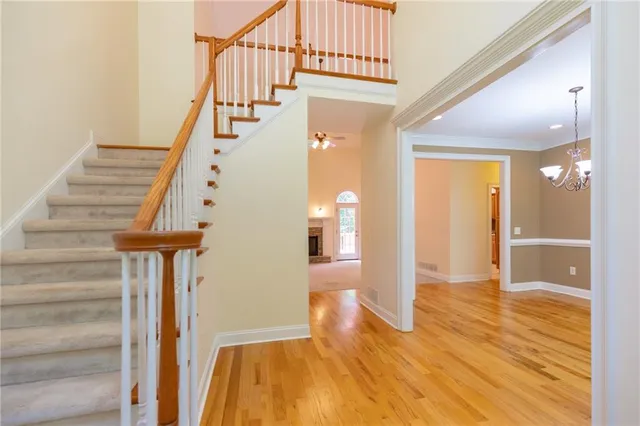 a view of entryway with wooden floor and staircase