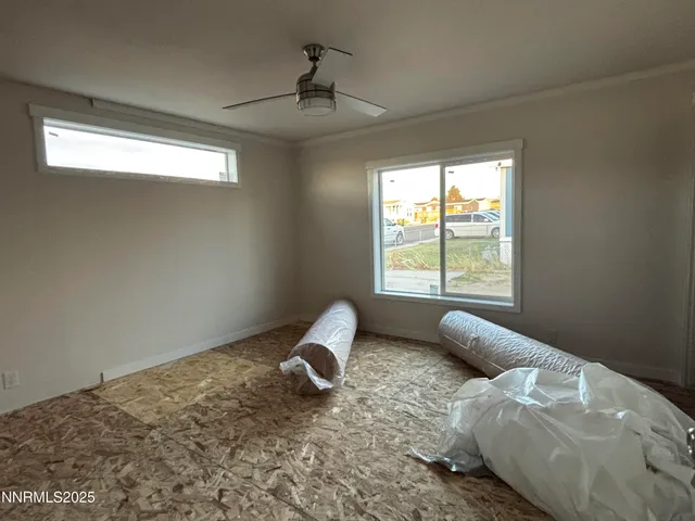 a room with bed and window