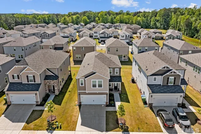 an aerial view of a house with a garden