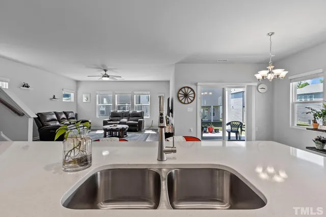 a kitchen with furniture and a table
