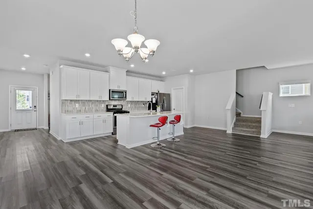 a view of an entryway with wooden floor