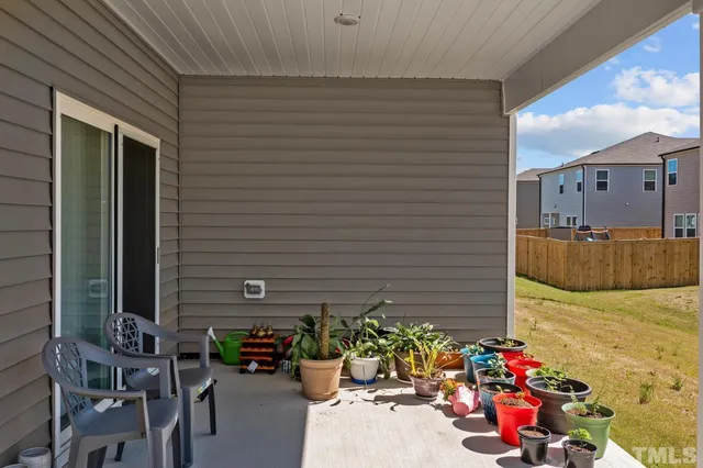a view of a house with a yard and garage
