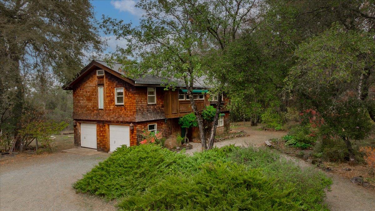 13375 Rue Montaigne Oregon House, CA 95962 - Photo 1 of 1 a view of a barn with big yard plants and large trees
