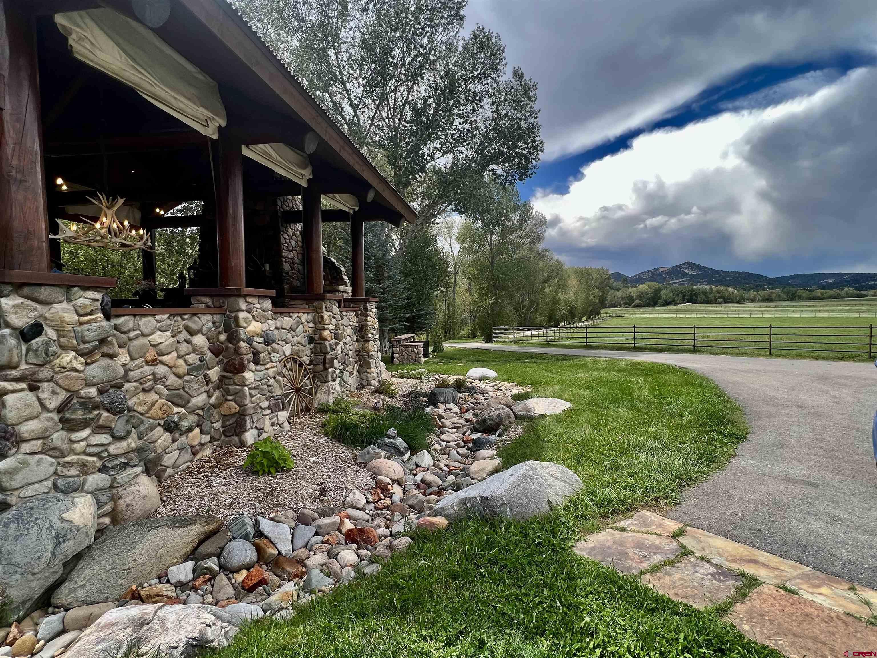 2777 County Road 225 Durango, CO 81301 - Photo 7 of 35 a view of a garden with a large tree