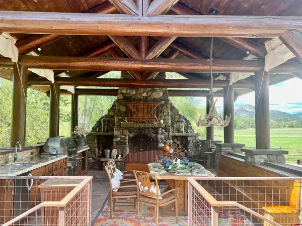 a view of a porch with wooden floor