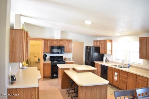 13643 East Bright Sky Loop Vail, AZ 85641 - Photo 5 of 22 a large kitchen with stainless steel appliances a stove a sink dishwasher and a refrigerator