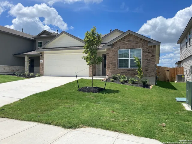 a house view with a garden space