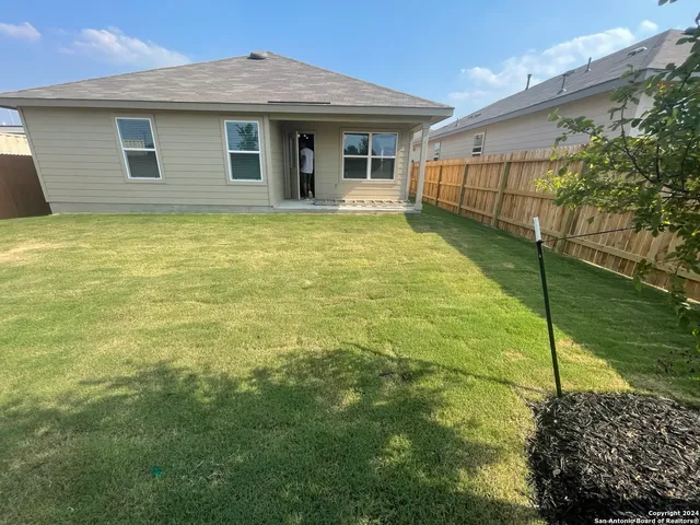a view of a swimming pool with an outdoor space and seating area
