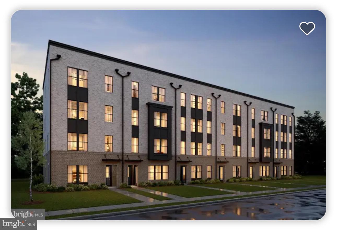 a view of a brick house with many windows