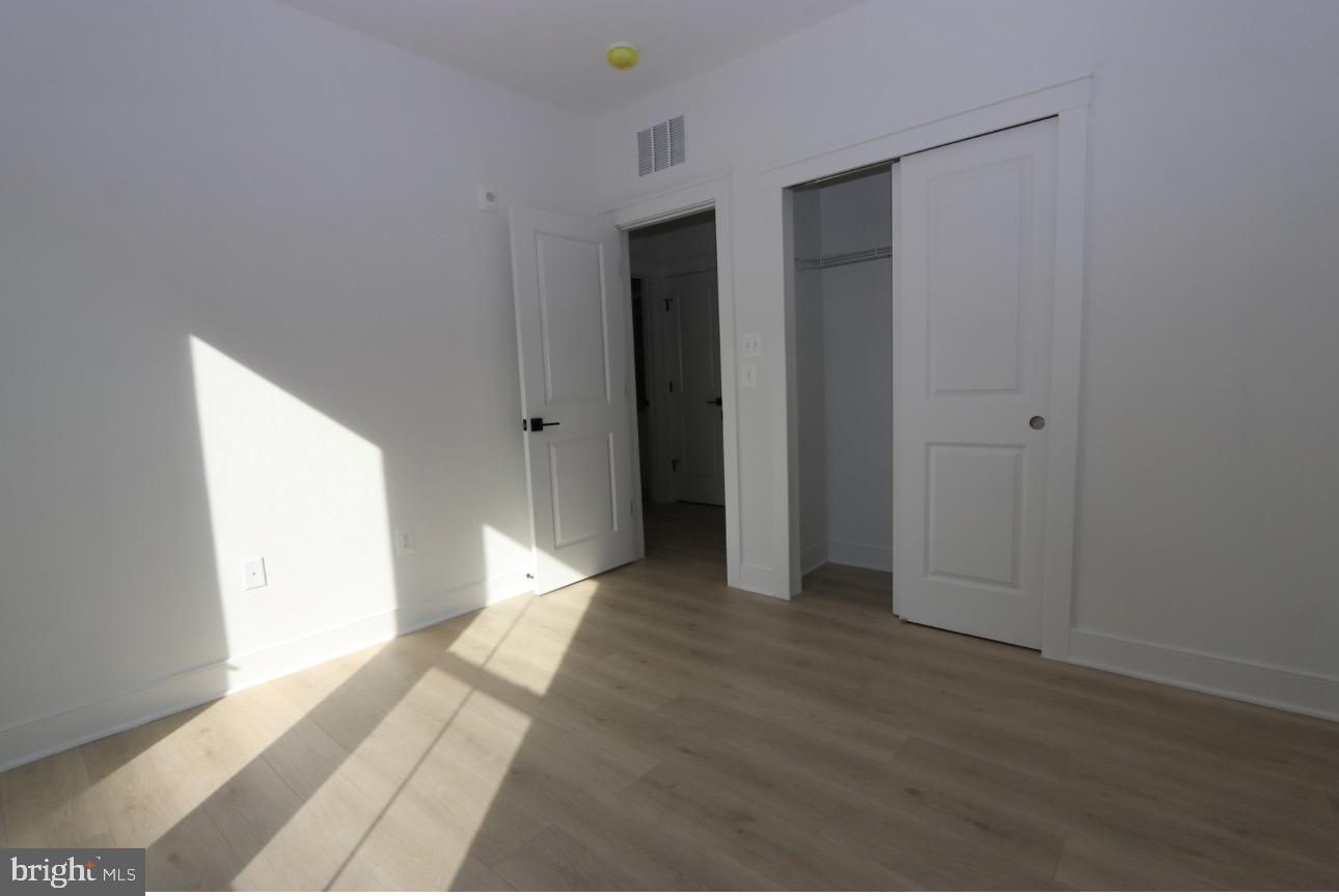 117 East Cromwell Street, Unit A Baltimore, MD 21230 - Photo 12 of 35 a view of an empty room and window