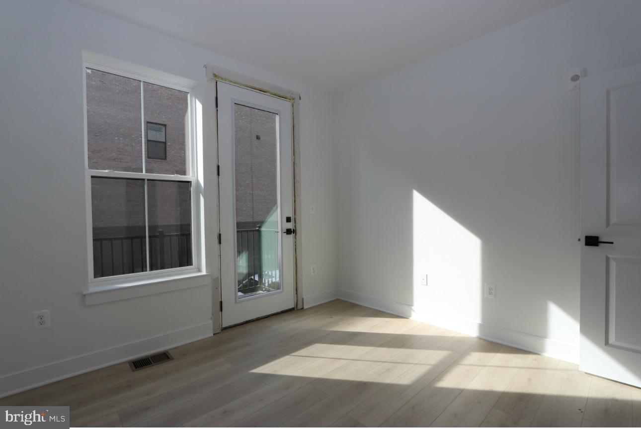 117 East Cromwell Street, Unit A Baltimore, MD 21230 - Photo 14 of 35 a view of an empty room with a window