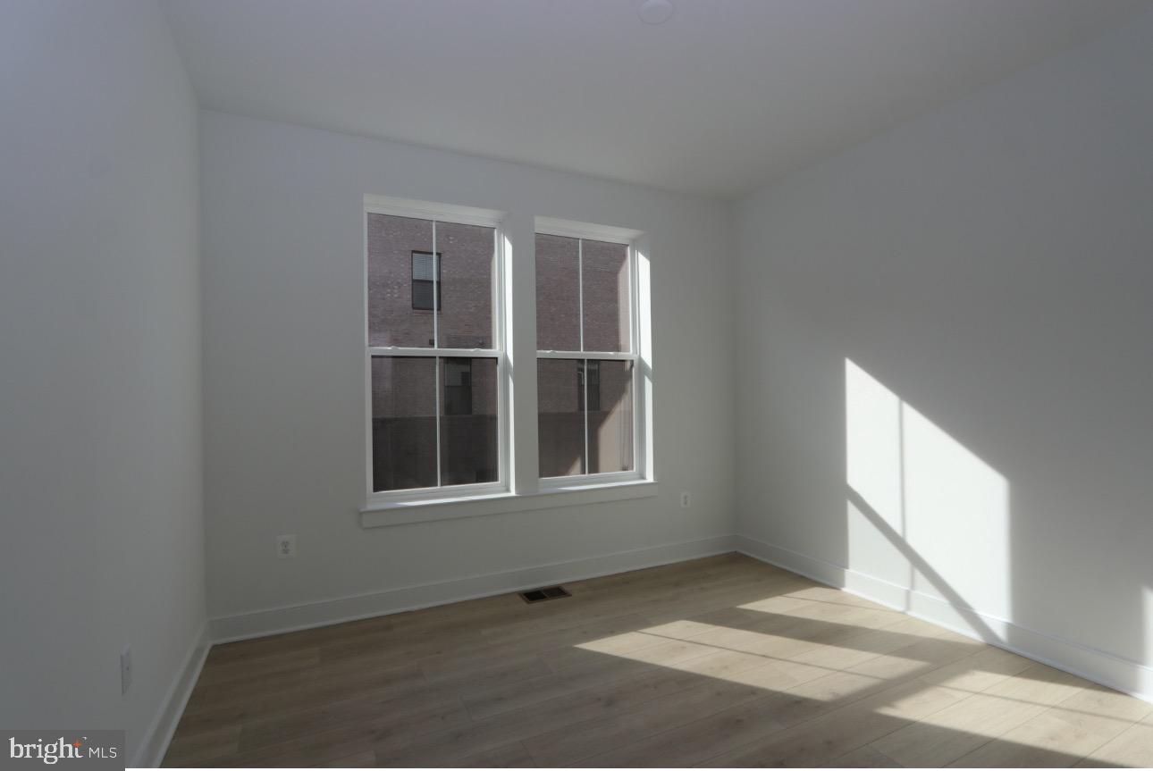 117 East Cromwell Street, Unit A Baltimore, MD 21230 - Photo 16 of 35 a view of an empty room with a window