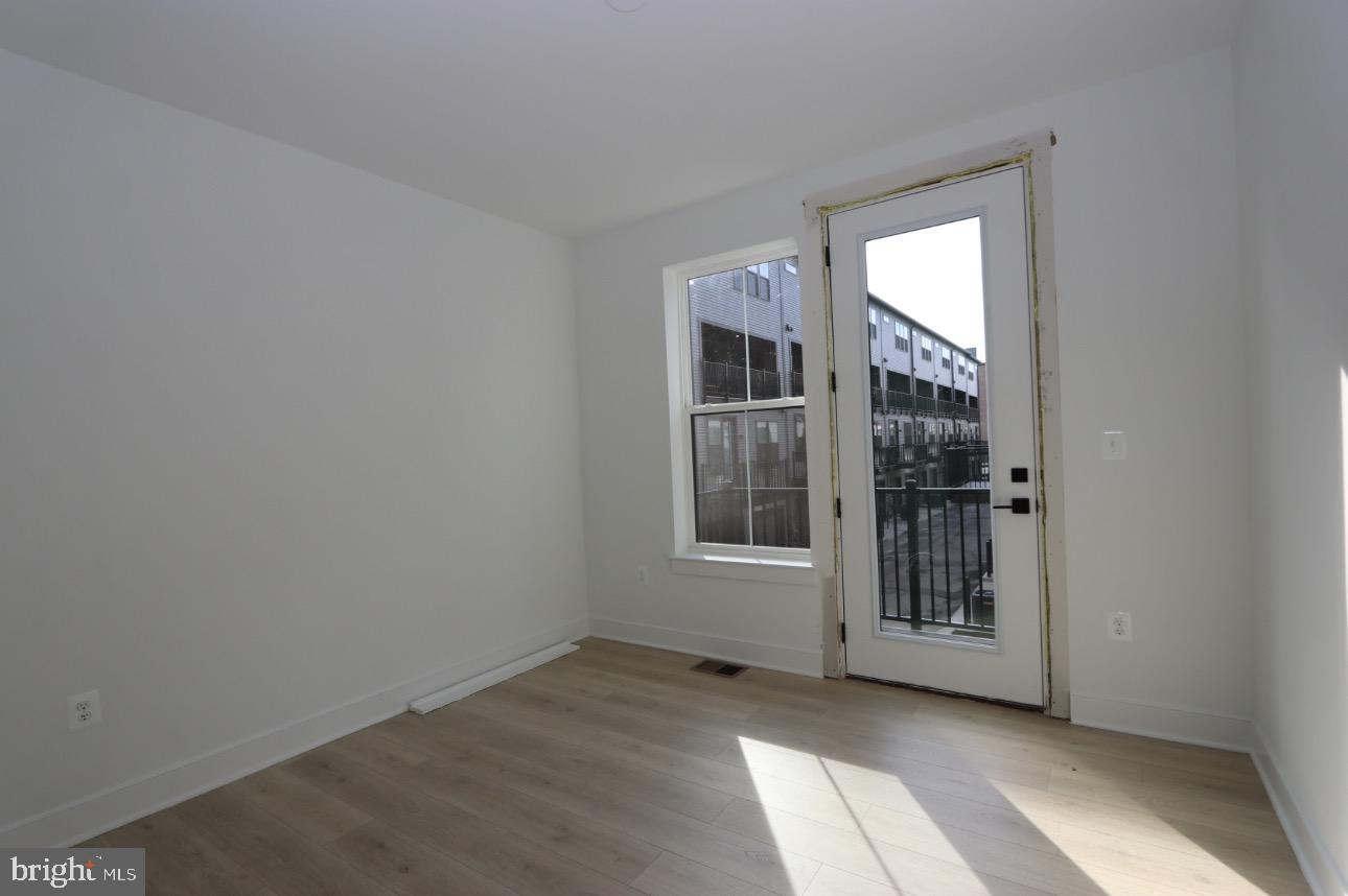 117 East Cromwell Street, Unit A Baltimore, MD 21230 - Photo 17 of 35 an empty room with windows