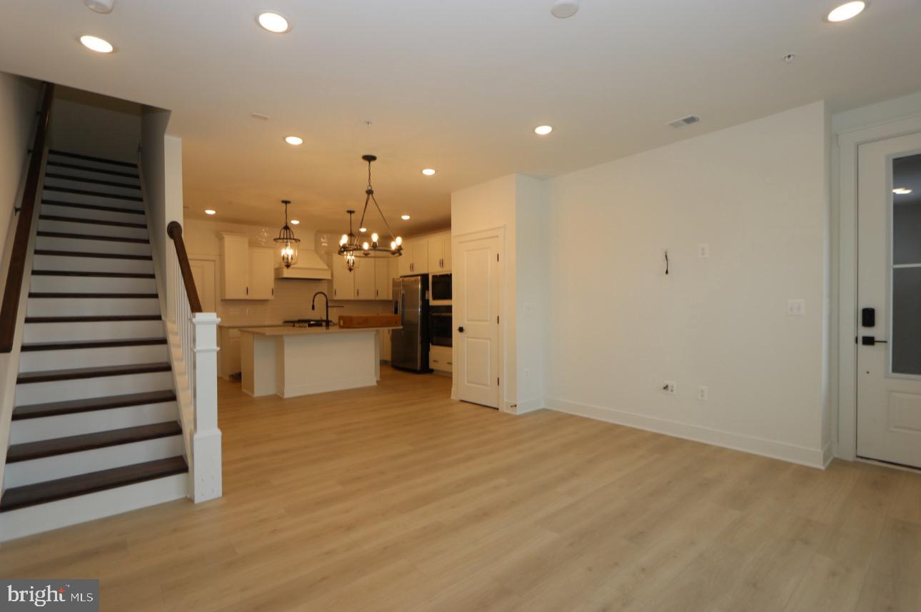 117 East Cromwell Street, Unit A Baltimore, MD 21230 - Photo 18 of 35 a view of a kitchen with cabinets and stainless steel appliances