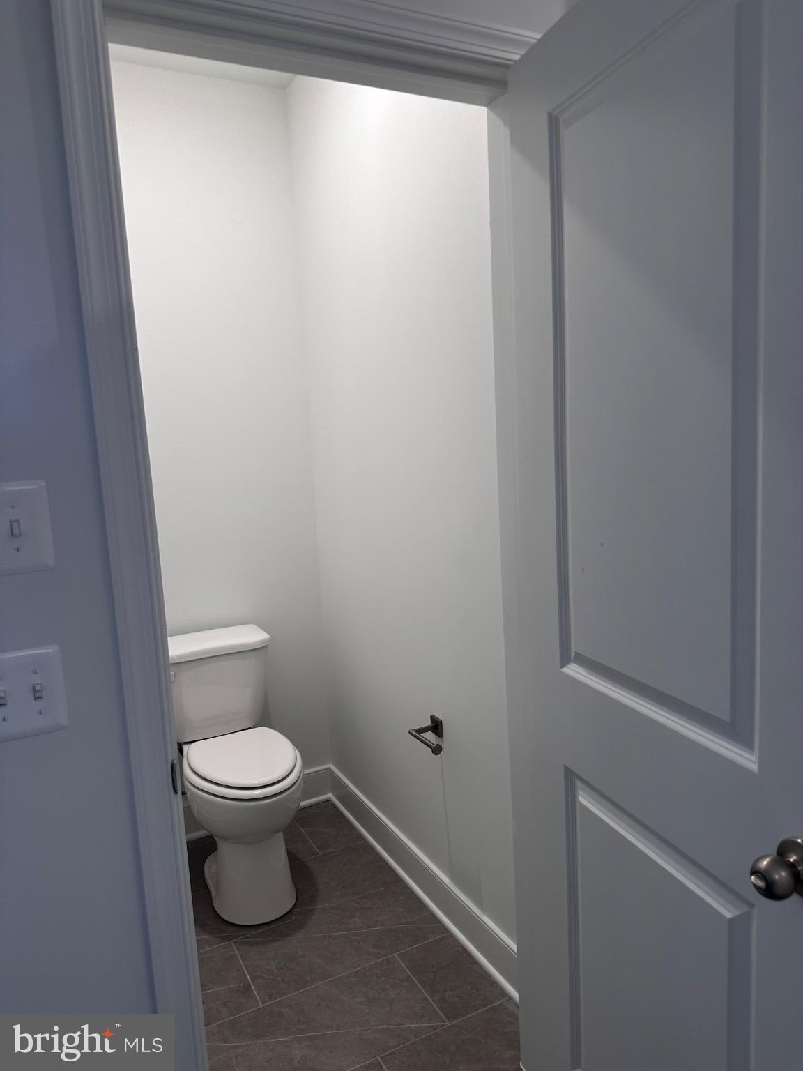 117 East Cromwell Street, Unit A Baltimore, MD 21230 - Photo 23 of 35 a bathroom with a toilet and a window