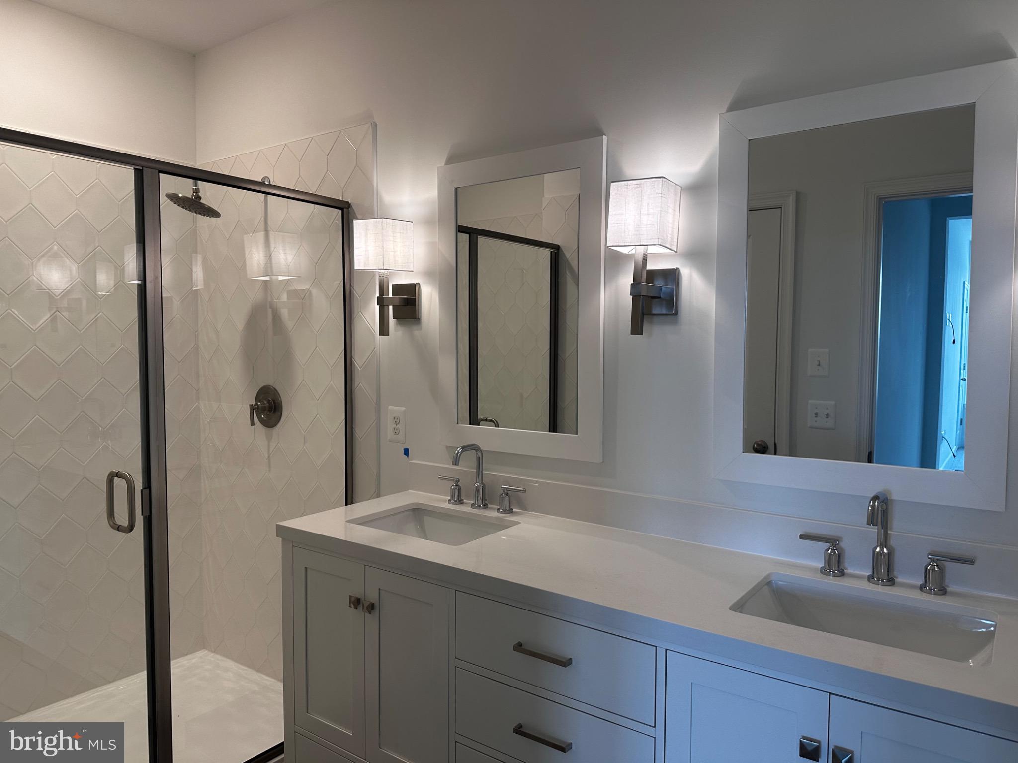 117 East Cromwell Street, Unit A Baltimore, MD 21230 - Photo 24 of 35 a bathroom with a granite countertop sink mirror and double