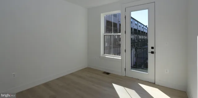 a view of empty room with windows