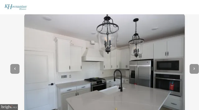 a kitchen with stainless steel appliances a refrigerator and a sink