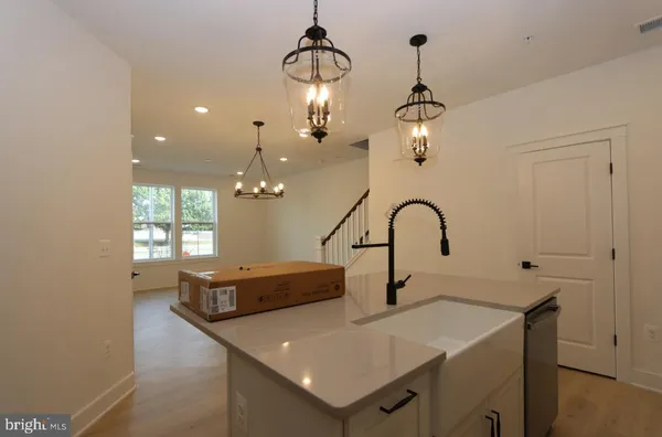 a view of a sink and chandelier