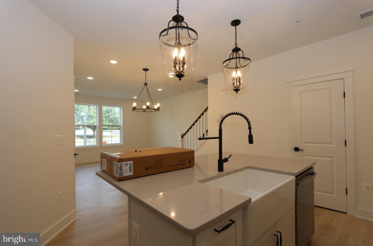 117 East Cromwell Street, Unit A Baltimore, MD 21230 - Photo 7 of 35 a view of a sink and chandelier
