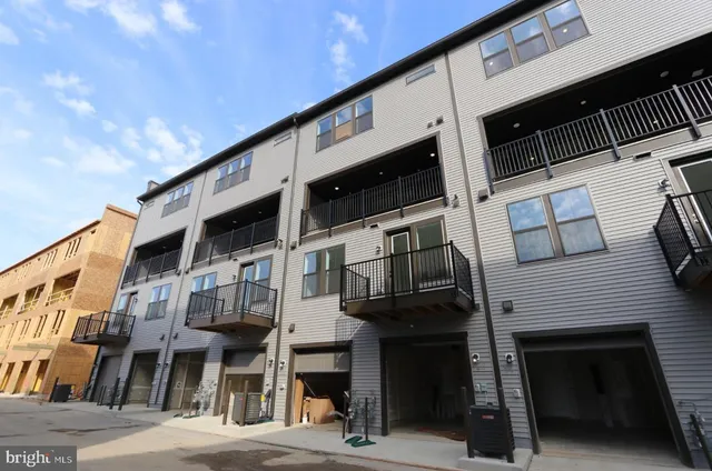 a front view of a building with a street