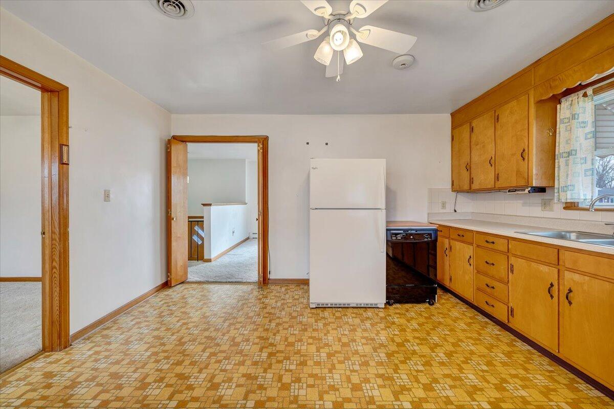 626 Santee Road Roanoke, VA 24019 - Photo 12 of 56 a kitchen with a refrigerator a sink and a stove top oven