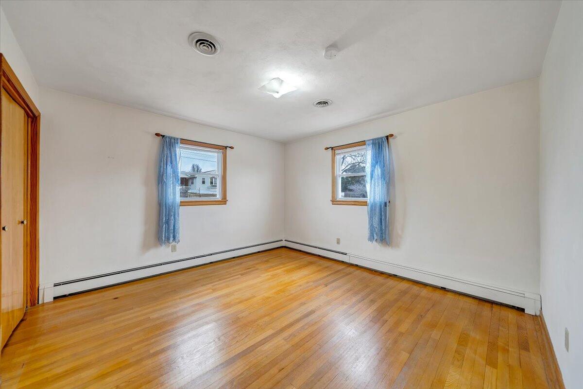 626 Santee Road Roanoke, VA 24019 - Photo 17 of 56 a view of empty room with wooden floor and fan