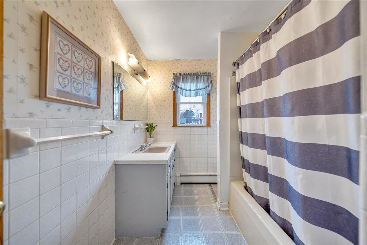 626 Santee Road Roanoke, VA 24019 - Photo 23 of 56 a bathroom with a sink a toilet a mirror and shower