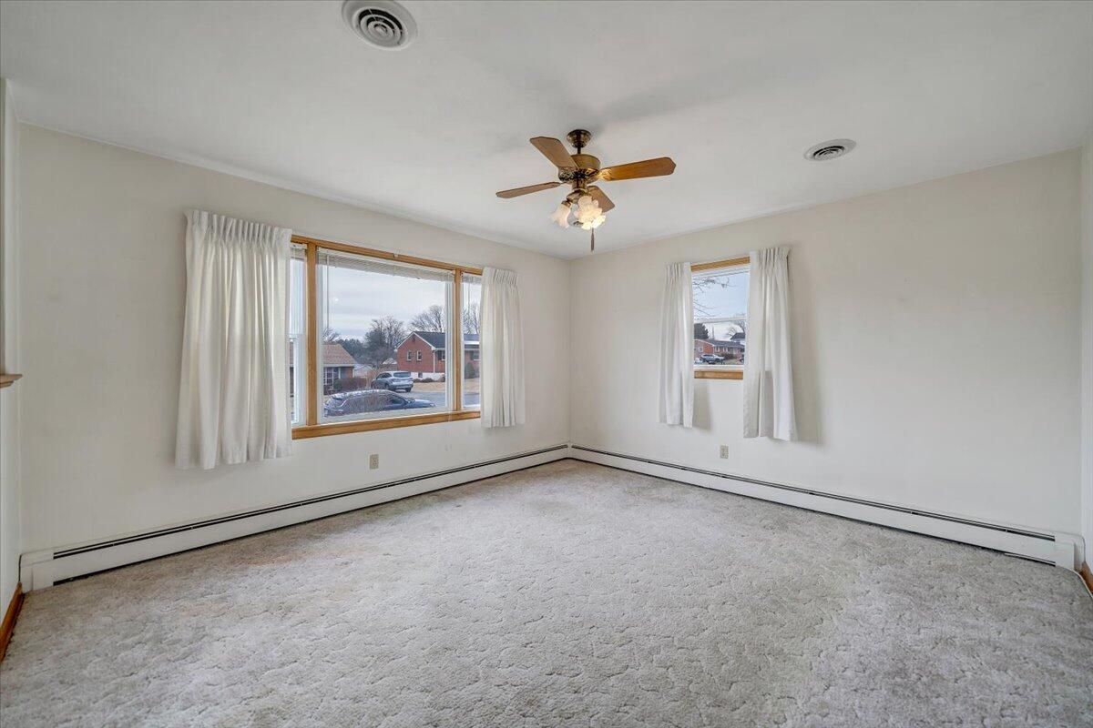 626 Santee Road Roanoke, VA 24019 - Photo 3 of 56 an empty room with windows and fan view