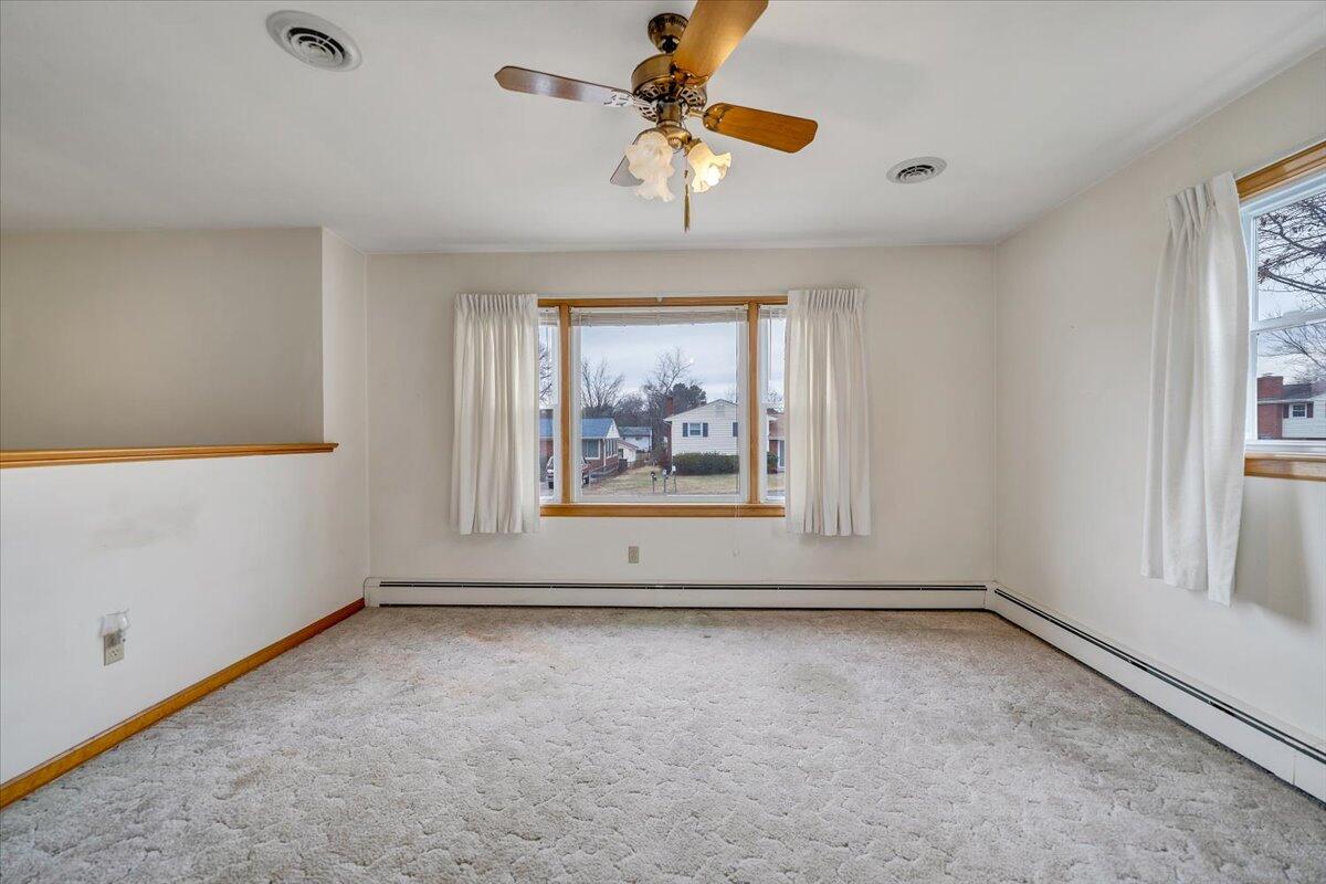 626 Santee Road Roanoke, VA 24019 - Photo 4 of 56 a view of an empty room with a window