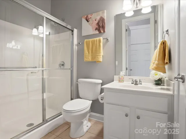 a bathroom with a toilet sink and shower