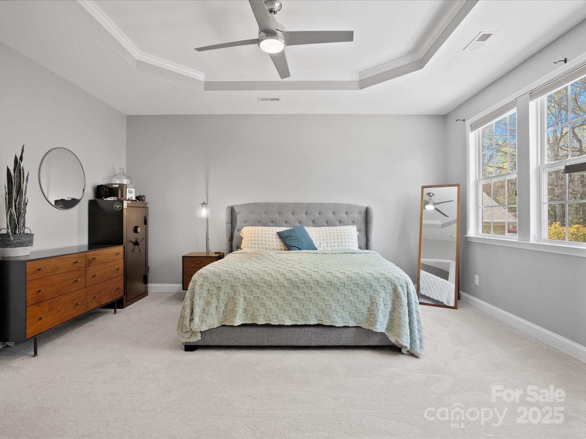 567 Quicksilver Trail Fort Mill, SC 29708 - Photo 21 of 37 a spacious bedroom with a bed and a dresser in it