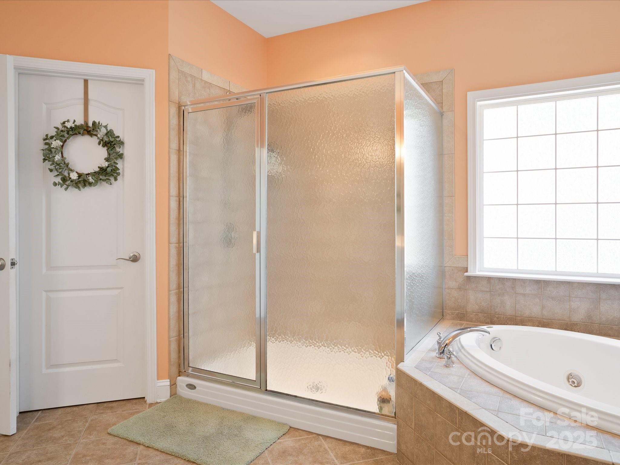 567 Quicksilver Trail Fort Mill, SC 29708 - Photo 24 of 37 a bathroom with a tub and shower