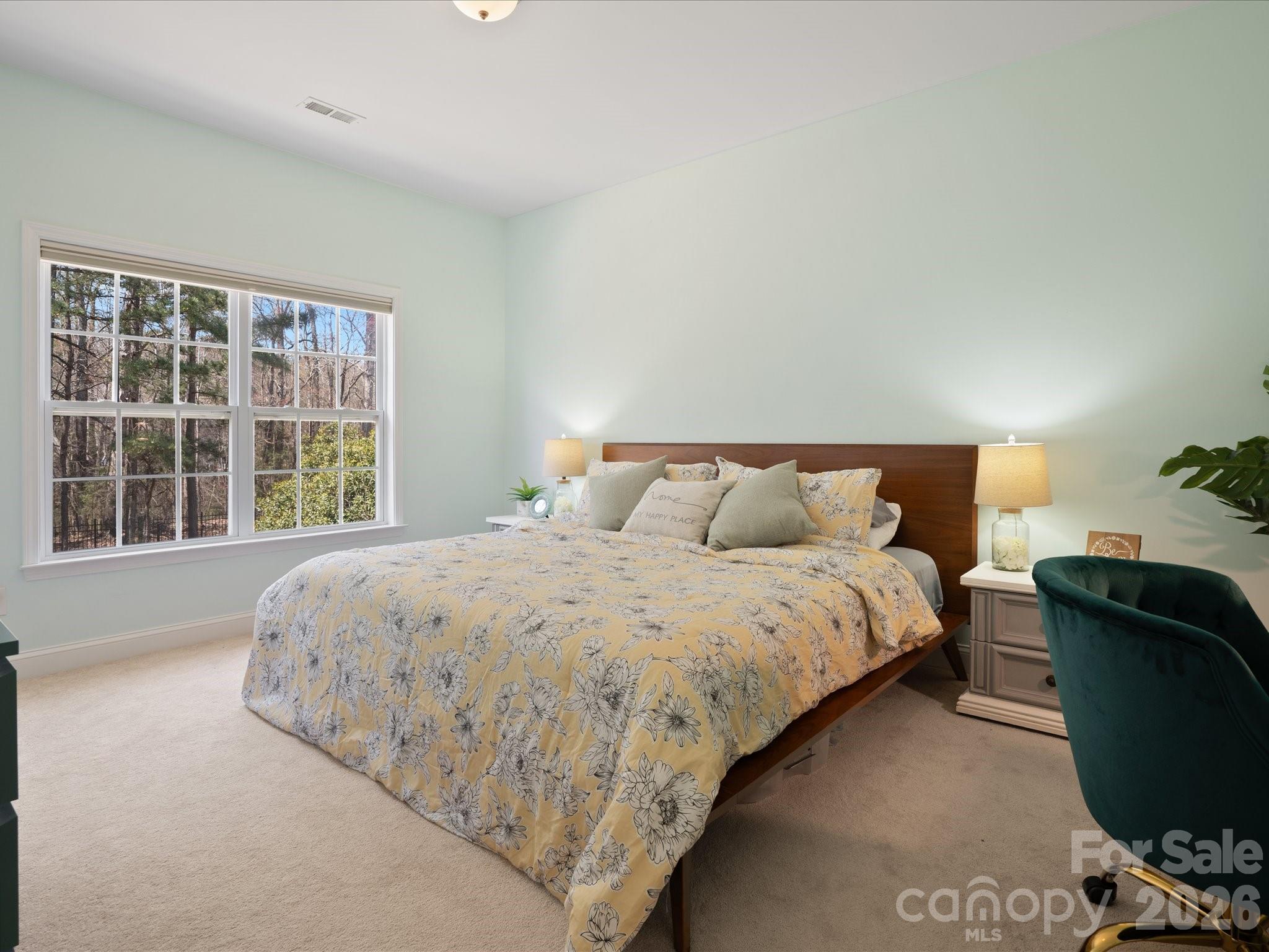567 Quicksilver Trail Fort Mill, SC 29708 - Photo 30 of 37 a bed sitting in a bedroom next to a window