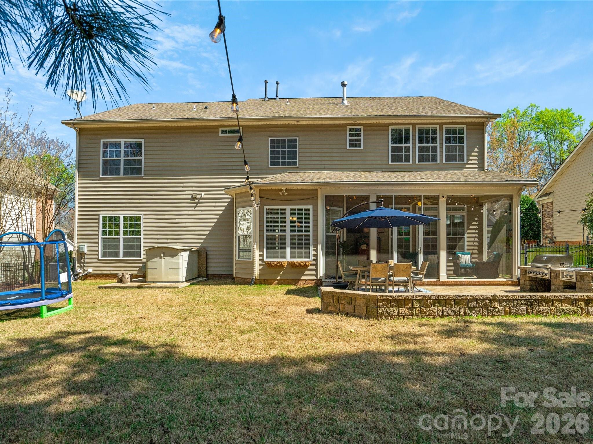 567 Quicksilver Trail Fort Mill, SC 29708 - Photo 3 of 37 a front view of a house with a yard fire pit and outdoor seating